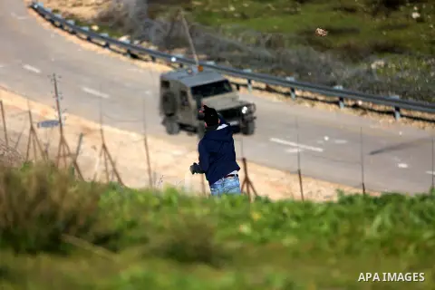 Palestinian protesters clash with Israeli security forces following a demonstration in solidarity with Palestinian prisoners in Israeli jails, outside the compound of the Israeli Ofer Military Prison, near the West Bank...