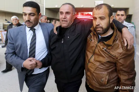 The father of Palestinian Haitham Al-Bau, who was shot and killed by Israeli soldiers, mourns at a hospital in the West Bank city of Hebron February 5, 2016. Israeli soldiers shot and killed Al-Bao, 17, in the occupied W...