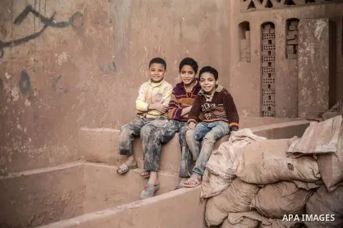 Egyptian boys, platy at a pottery workshop in Cairo, on February 6, 2016. Pottery is an ancient and traditional craft in Gaza. Local workshops usually produce products such as bowls, pitchers, flower pots, and vases. Pho...