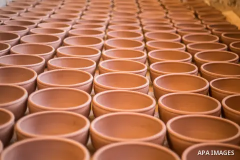 Pottery vessels are seen drying at a pottery workshop in Cairo, on February 6, 2016. Pottery is an ancient and traditional craft in Gaza. Local workshops usually produce products such as bowls, pitchers, flower pots, and...