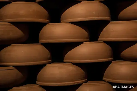 Pottery vessels are seen drying at a pottery workshop in Cairo, on February 6, 2016. Pottery is an ancient and traditional craft in Gaza. Local workshops usually produce products such as bowls, pitchers, flower pots, and...
