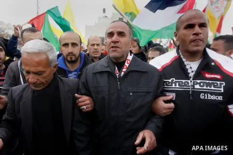 Mourners carry the body of Palestinian Haitham Al-Bau, who was shot and killed by Israeli soldiers, during his funeral, in the West Bank city of Hebron February 6, 2016. Israeli soldiers shot and killed Al-Bao, 17, in th...