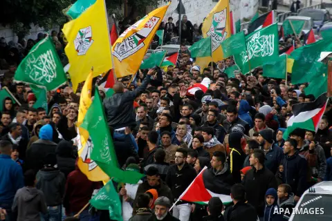 Mourners carry the body of Palestinian Haitham Al-Bau, who was shot and killed by Israeli soldiers, during his funeral, in the West Bank city of Hebron February 6, 2016. Israeli soldiers shot and killed Al-Bao, 17, in th...