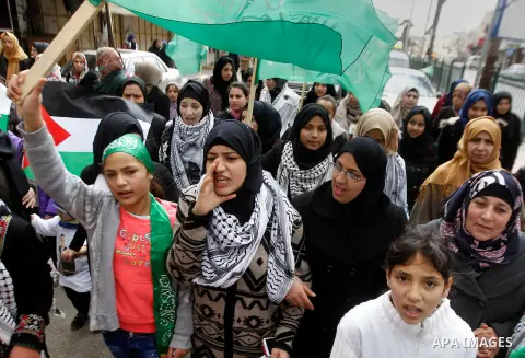Mourners carry the body of Palestinian Haitham Al-Bau, who was shot and killed by Israeli soldiers, during his funeral, in the West Bank city of Hebron February 6, 2016. Israeli soldiers shot and killed Al-Bao, 17, in th...