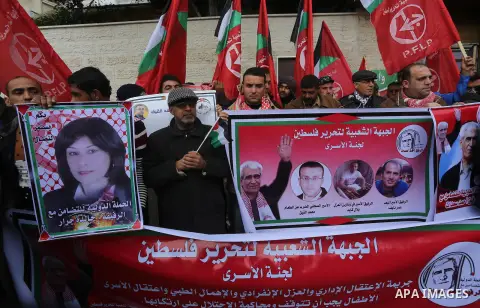 Palestinians take part in a protest demanding release the prisoners in Israeli jails, in front of Red cross office, in Gaza city, on February 8, 2016. Photo by Mohammed Asad