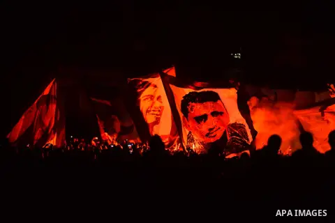 Al-Zamalek soccer club fans known as 'Ultras White Knights" light flares and shout slogans to mark the first anniversary of killing al-Zamalek fans in Cairo, Egypt, Feb. 08, 2016. At least 22 soccer fans were crushed to...
