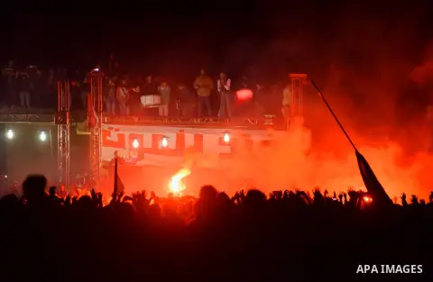 Al-Zamalek soccer club fans known as 'Ultras White Knights" light flares and shout slogans to mark the first anniversary of killing al-Zamalek fans in Cairo, Egypt, Feb. 08, 2016. At least 22 soccer fans were crushed to...
