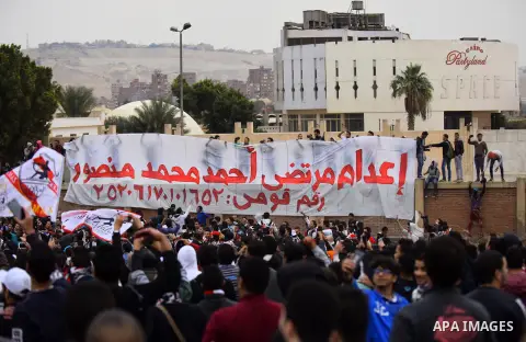 Al-Zamalek soccer club fans known as 'Ultras White Knights" light flares and shout slogans to mark the first anniversary of killing al-Zamalek fans in Cairo, Egypt, Feb. 08, 2016. At least 22 soccer fans were crushed to...
