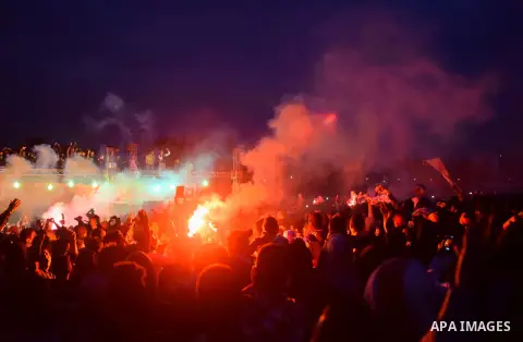Al-Zamalek soccer club fans known as 'Ultras White Knights" light flares and shout slogans to mark the first anniversary of killing al-Zamalek fans in Cairo, Egypt, Feb. 08, 2016. At least 22 soccer fans were crushed to...