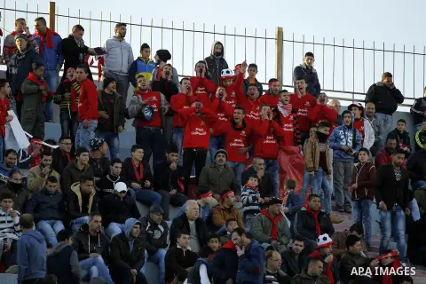 Fans attend the crucial AFC Champions League Playoff phase football match between Palestinian's Ahly Al-Khalil football team and FC Khujand team at Dura Stadium in the West Bank city of Hebron on Feb. 09, 2016. Mahmoud W...