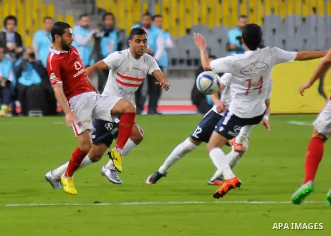 Al Ahly players compete against with Zamalek players during their Egyptian Premier League derby soccer match at Borg El Arab "Army Stadium" near Alexandria, Egypt, February 9, 2016. Photo by Amr Sayed