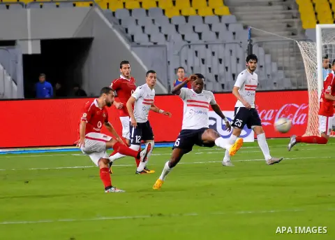 Al Ahly players compete against with Zamalek players during their Egyptian Premier League derby soccer match at Borg El Arab "Army Stadium" near Alexandria, Egypt, February 9, 2016. Photo by Amr Sayed