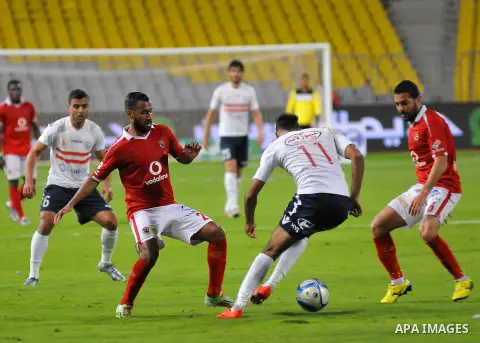 Al Ahly players compete against with Zamalek players during their Egyptian Premier League derby soccer match at Borg El Arab "Army Stadium" near Alexandria, Egypt, February 9, 2016. Photo by Amr Sayed