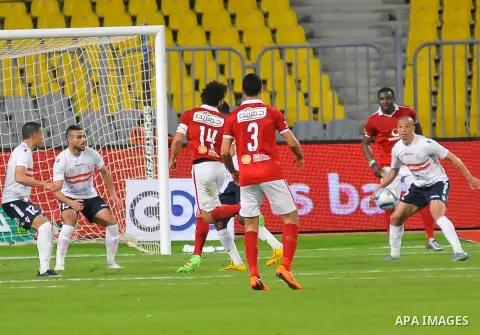 Al Ahly players compete against with Zamalek players during their Egyptian Premier League derby soccer match at Borg El Arab "Army Stadium" near Alexandria, Egypt, February 9, 2016. Photo by Amr Sayed
