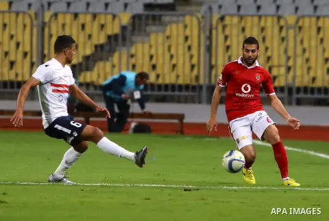 Al Ahly players compete against with Zamalek players during their Egyptian Premier League derby soccer match at Borg El Arab "Army Stadium" near Alexandria, Egypt, February 9, 2016. Photo by Amr Sayed