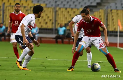 Al Ahly players compete against with Zamalek players during their Egyptian Premier League derby soccer match at Borg El Arab "Army Stadium" near Alexandria, Egypt, February 9, 2016. Photo by Amr Sayed