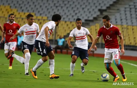 Al Ahly players compete against with Zamalek players during their Egyptian Premier League derby soccer match at Borg El Arab "Army Stadium" near Alexandria, Egypt, February 9, 2016. Photo by Amr Sayed
