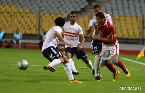 Al Ahly players compete against with Zamalek players during their Egyptian Premier League derby soccer match at Borg El Arab "Army Stadium" near Alexandria, Egypt, February 9, 2016. Photo by Amr Sayed