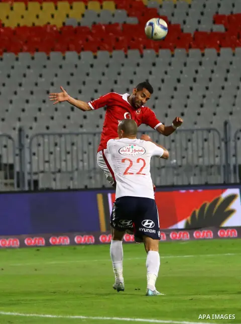 Al Ahly players compete against with Zamalek players during their Egyptian Premier League derby soccer match at Borg El Arab "Army Stadium" near Alexandria, Egypt, February 9, 2016. Photo by Amr Sayed