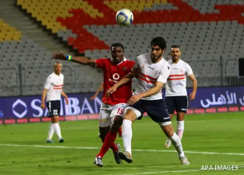 Al Ahly players compete against with Zamalek players during their Egyptian Premier League derby soccer match at Borg El Arab "Army Stadium" near Alexandria, Egypt, February 9, 2016. Photo by Amr Sayed