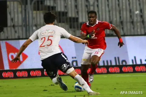 Al Ahly players compete against with Zamalek players during their Egyptian Premier League derby soccer match at Borg El Arab "Army Stadium" near Alexandria, Egypt, February 9, 2016. Photo by Amr Sayed