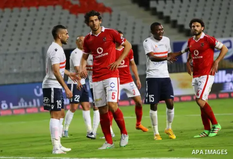 Al Ahly players compete against with Zamalek players during their Egyptian Premier League derby soccer match at Borg El Arab "Army Stadium" near Alexandria, Egypt, February 9, 2016. Photo by Amr Sayed
