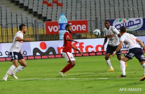 Al Ahly players compete against with Zamalek players during their Egyptian Premier League derby soccer match at Borg El Arab "Army Stadium" near Alexandria, Egypt, February 9, 2016. Photo by Amr Sayed