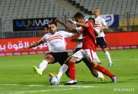 Al Ahly players compete against with Zamalek players during their Egyptian Premier League derby soccer match at Borg El Arab "Army Stadium" near Alexandria, Egypt, February 9, 2016. Photo by Amr Sayed