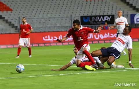 Al Ahly players compete against with Zamalek players during their Egyptian Premier League derby soccer match at Borg El Arab "Army Stadium" near Alexandria, Egypt, February 9, 2016. Photo by Amr Sayed