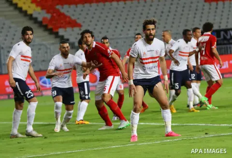 Al Ahly players compete against with Zamalek players during their Egyptian Premier League derby soccer match at Borg El Arab "Army Stadium" near Alexandria, Egypt, February 9, 2016. Photo by Amr Sayed