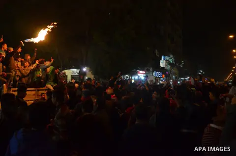 Fans of Al Ahly football club celebrate after their Egyptian Premier League derby soccer match against El Zamalek at Borg El Arab "Army Stadium" near Alexandria, Egypt, February 9, 2016. Photo by Amr Sayed