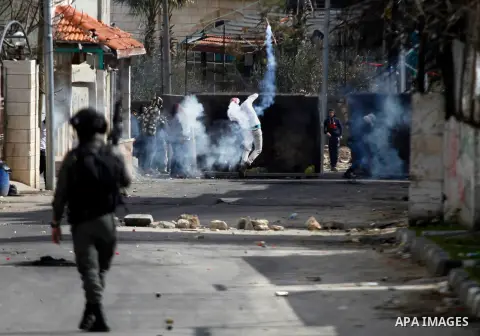 Palestinian protesters clash with Israeli security forces following the funeral of Omar Jawabra, who was killed by Israeli fire during clashes near hebron the day before, at al-Aroub Palestinian refugee camp, north the W...