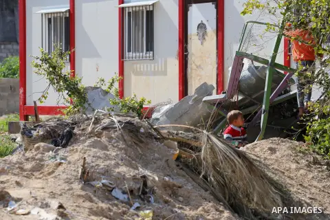 Palestinian children play in front of the remains of a house, destroyed during 2014 war, in Shijaiyah neighborhood in the east of Gaza city on Feb. 11, 2016. Rebuilding of Palestinian houses which destroyed during 2014 w...