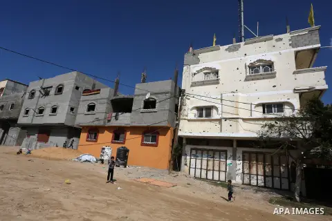 Palestinian children play in front of the remains of a house, destroyed during 2014 war, in Shijaiyah neighborhood in the east of Gaza city on Feb. 11, 2016. Rebuilding of Palestinian houses which destroyed during 2014 w...