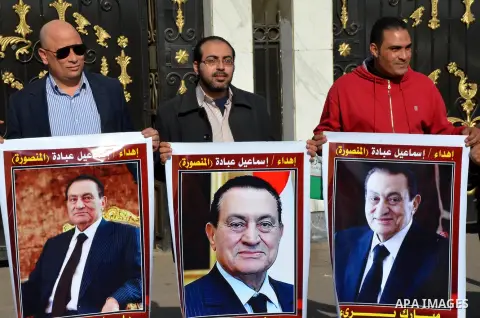 Supporters of Egypt's former president Hosni Mubarak take part during a protest to show solidarity with him outside the Maadi military hospital in Cairo on Feb. 11, 2016. Photo by Amr Sayed