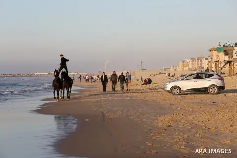 A Palestinian youth shows his skills on rides horses on the beach of Gaza city on Feb. 12, 2016. Photo by Mohammed Asad
