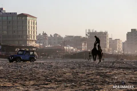 A Palestinian youth shows his skills on rides horses on the beach of Gaza city on Feb. 12, 2016. Photo by Mohammed Asad