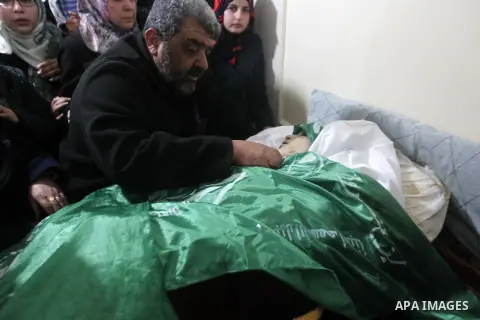 Palestinian relatives react next to the body of 17-year-old woman Kilzar Owaiwi, who was shot dead by Israeli troops after the troops said she attempted to stab an Israeli soldier, in the West Bank city of Hebron Februar...