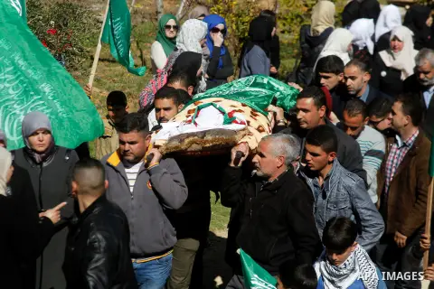 Mouerners cary the body of Kalzar al-Uweiwi, a Palestinian teenager who was killed a day earlier following a reported stabbing attack, during her funeral, in the West Bank city of Hebron, February 14, 2016. Israeli force...