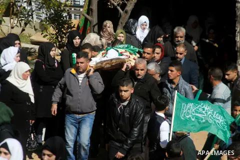 Mouerners cary the body of Kalzar al-Uweiwi, a Palestinian teenager who was killed a day earlier following a reported stabbing attack, during her funeral, in the West Bank city of Hebron, February 14, 2016. Israeli force...