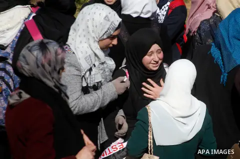 The relatives of Palestinian Kalzar al-Uweiwi, a Palestinian teenager who was killed a day earlier following a reported stabbing attack, mourn during her funeral, in the West Bank city of Hebron, February 14, 2016. Israe...