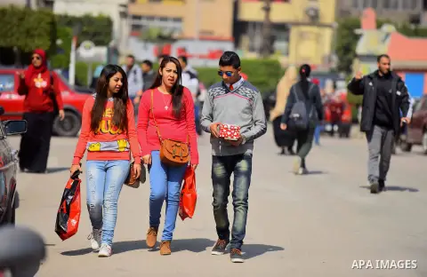 Egyptian students celebrate on Valentine's day at Cairo University, in Cairo on February 14, 2016. Valentine's Day is increasingly popular in the region as people have taken up the custom of giving flowers, cards, chocol...
