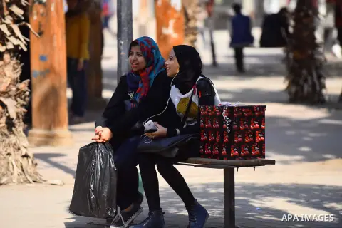 Egyptian students celebrate on Valentine's day at Cairo University, in Cairo on February 14, 2016. Valentine's Day is increasingly popular in the region as people have taken up the custom of giving flowers, cards, chocol...