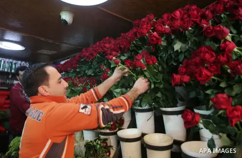 Palestinian vendors display flowers red teddy bears and pillows on Valentine's day in the West Bank city of Ramallah, on February 14, 2016. Valentine's Day is increasingly popular in the region as people have taken up th...