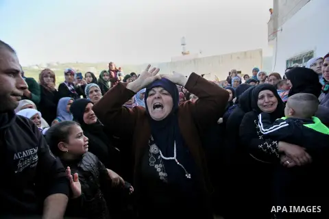 Relatives of Palestinian Nihad Waked who was shot dead by Israeli security forces as they reported fired on Israeli soldiers mourn during their funeral on February 14, 2016 in the village of Araka, West of Jenin in the I...