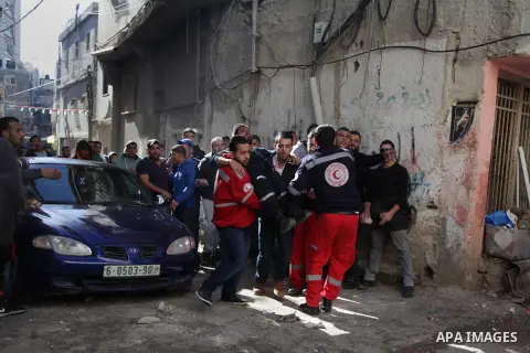 A Palestinian man, reported to be injured in the foot, is evacuated on February 15, 2016 on a street at the Amari refugee camp, near the West Bank city of Ramallah, during clashes that erupted after Israeli soldiers ente...