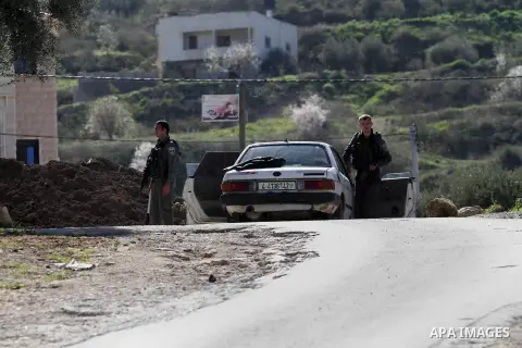 Israeli security forces inspect a car during clashes with Palestinian protesters in the village of Araka, West of Jenin in the Israeli occupied West Bank on February 15, 2016. Photo by Nedal Eshtayah