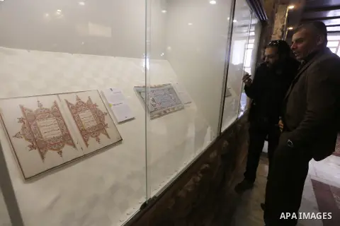 Palestinians attend the Islamic art gallery organized by the Dutch embassy in Gaza city on Feb. 16, 2016. Photo by Mohammed Asad
