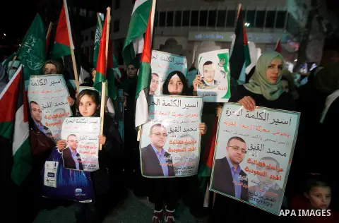 Palestinians take part in a demonstration calling for the release of Mohammed al-Qiq, a Palestinian prisoner on hunger strike, in the West bank city of Hebron on February 16, 2016. Israel's top court rejected Qiq's reque...