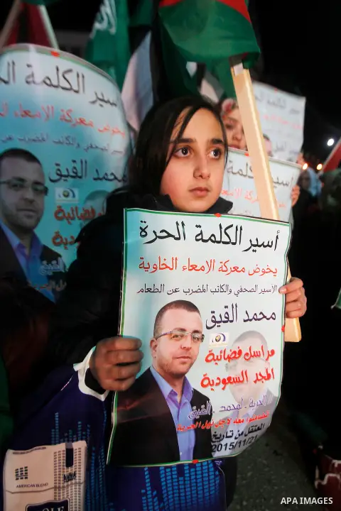 Palestinians take part in a demonstration calling for the release of Mohammed al-Qiq, a Palestinian prisoner on hunger strike, in the West bank city of Hebron on February 16, 2016. Israel's top court rejected Qiq's reque...